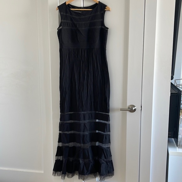 Long, chic black Tadashi Shoji gown with mesh-like panels and ribbed midsection - Picture 3 of 12